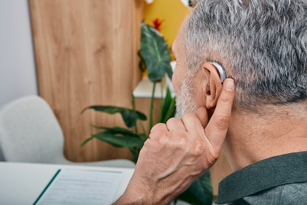 Elderly man with hearing aid